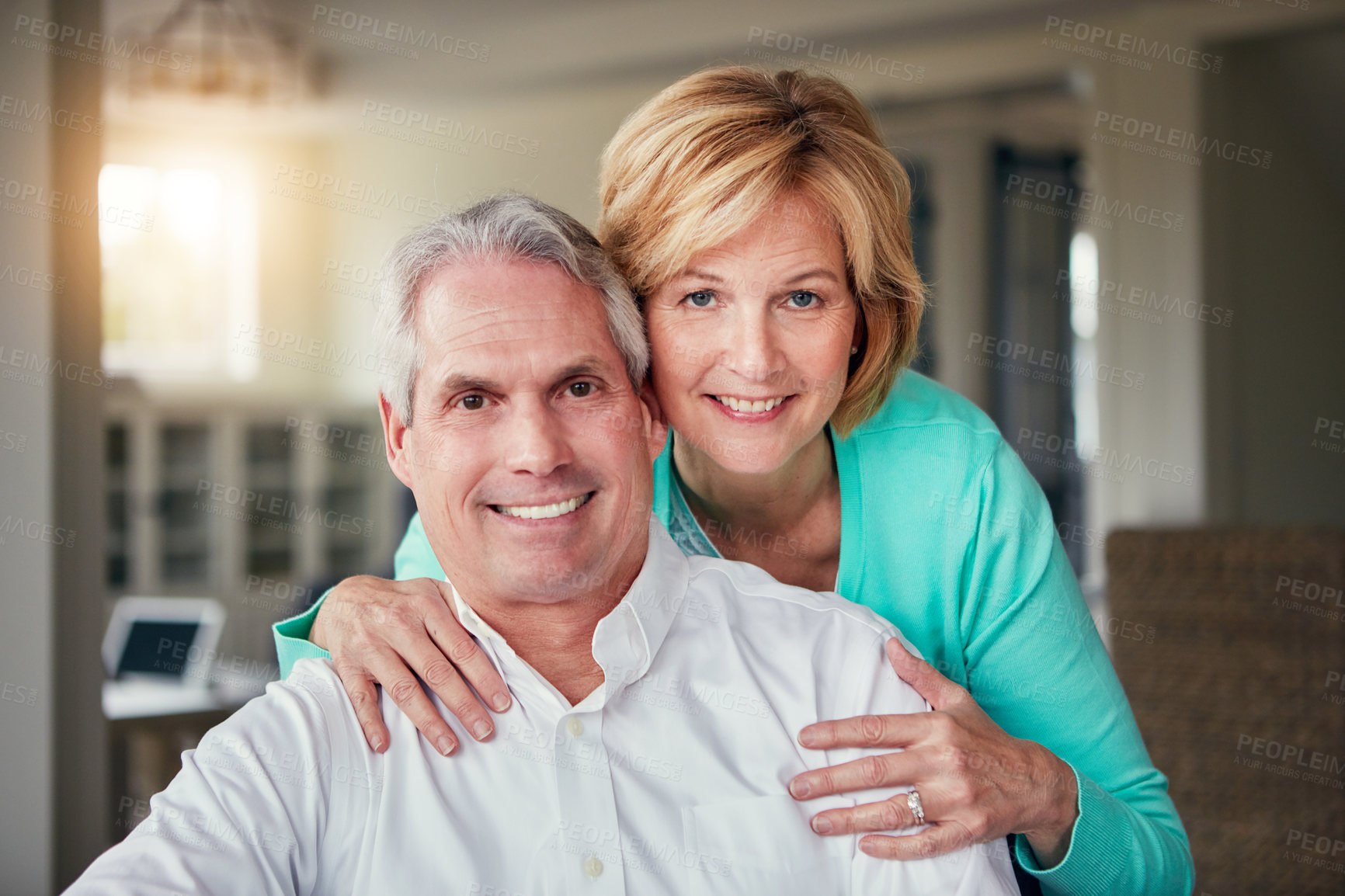 Buy stock photo Portrait of a mature couple relaxing together at home