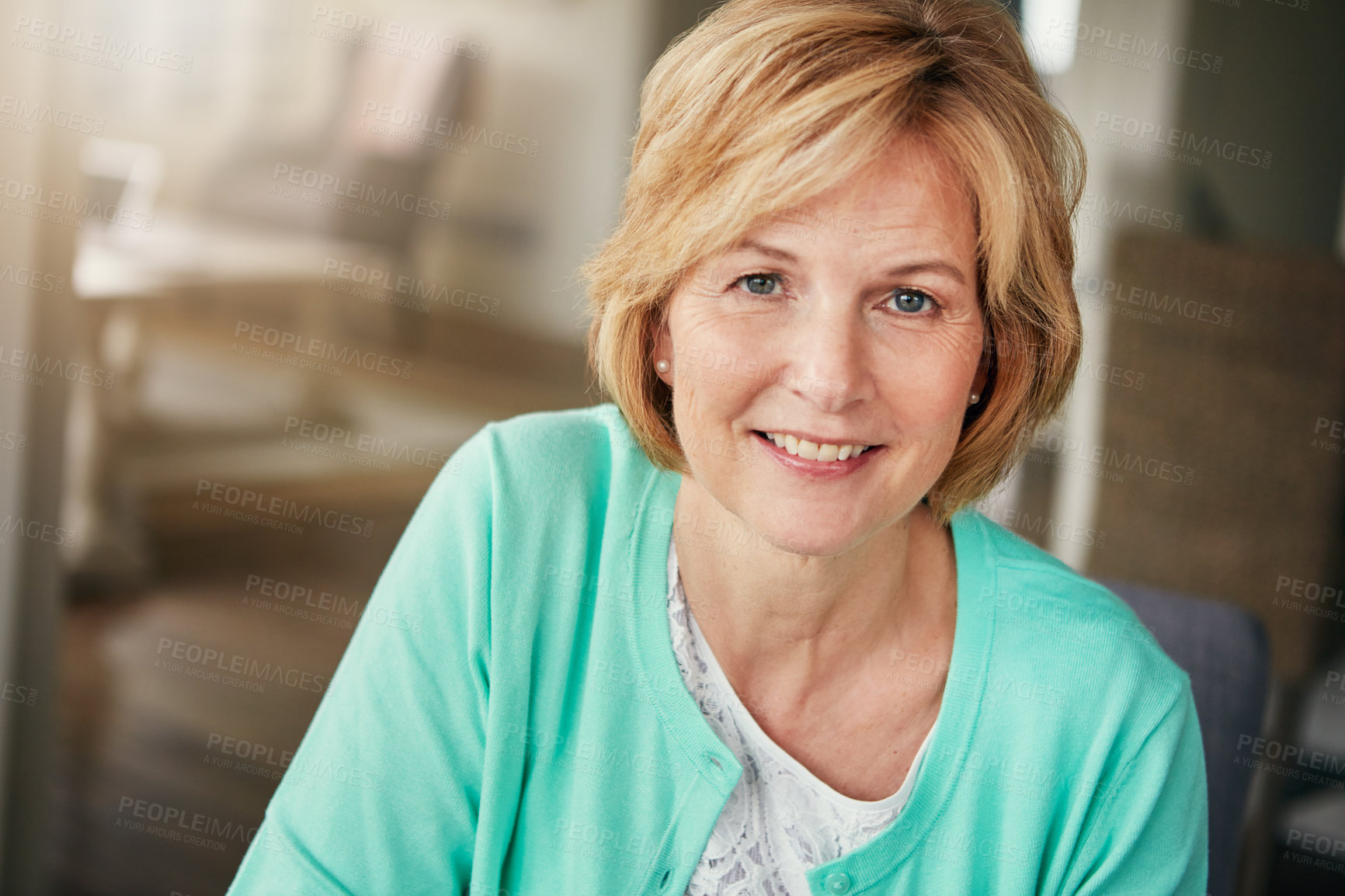 Buy stock photo Portrait of a mature woman relaxing at home