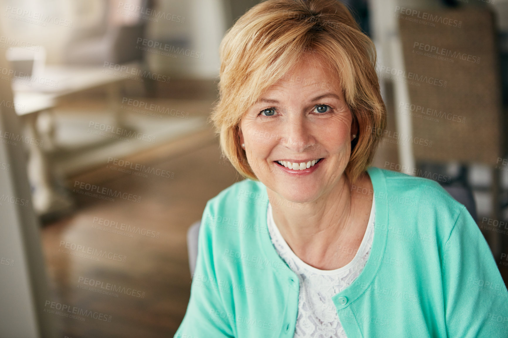 Buy stock photo Portrait of a mature woman relaxing at home