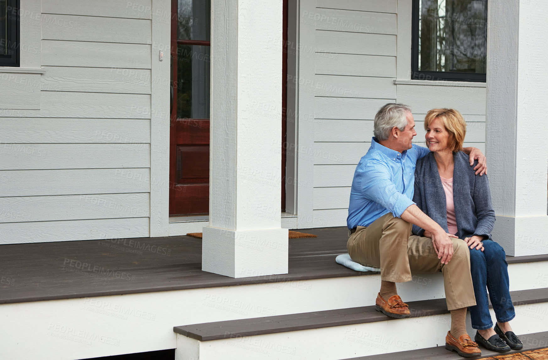 Buy stock photo Home, outdoor and hug with mature couple with love, retirement and happiness with relationship, marriage and real estate. House, front yard and senior man with old woman, embrace and bonding together