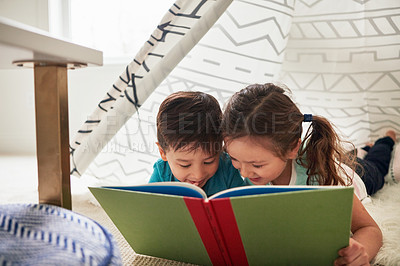 Buy stock photo Boy, girl and reading in tent with book for story time, education and literature adventure for storytelling. Children, siblings and home on floor for fantasy or bonding, learning and development.