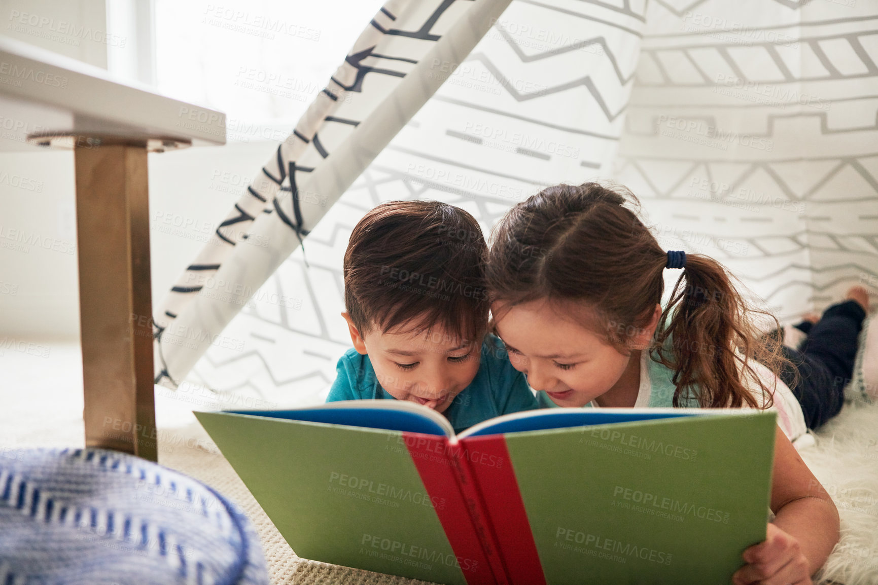 Buy stock photo Boy, girl and reading in tent with book for story time, education and literature adventure for storytelling. Children, siblings and home on floor for fantasy or bonding, learning and development.