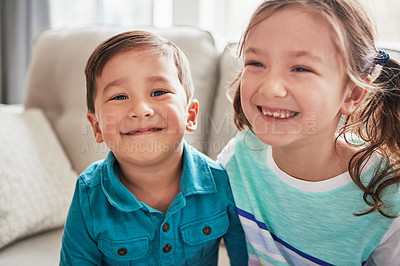 Buy stock photo Portrait of two happy little siblings at home