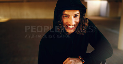 Buy stock photo Cropped portrait of a young man chilling outside in an underground parking lot