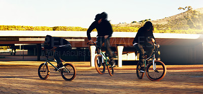 Buy stock photo Full length shot of a young male BMX rider doing tricks around the city