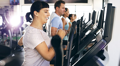 Buy stock photo Cropped shot of a group of young people working out on treadmills in the gym