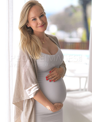 Buy stock photo Cropped portrait of a beautiful young pregnant woman standing in her home