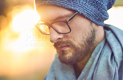 Buy stock photo Cropped shot of a handsome young man outdoors during fall