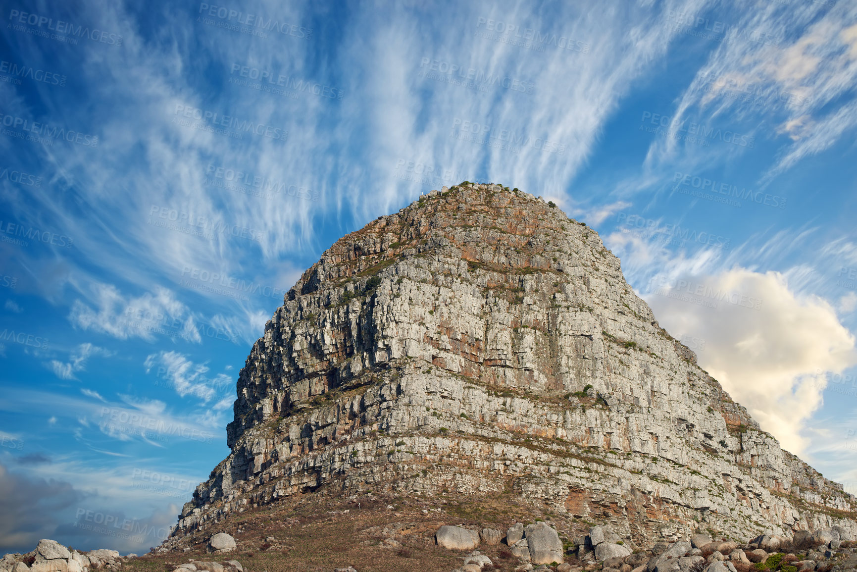 Buy stock photo Copyspace with scenic landscape view of Lions Head mountain in Cape Town South Africa against a cloudy blue sky background from below. Magnificent panoramic of a famous attraction and iconic landmark