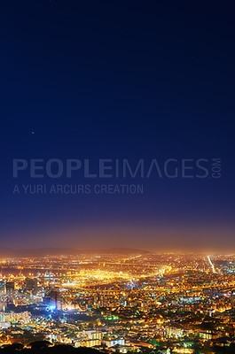 Buy stock photo Copy space with dark night sky over a cityscape view as seen from Signal Hill in Cape Town, South Africa. Scenic panoramic landscape of lights illuminating a metropolitan skyline in the city centre