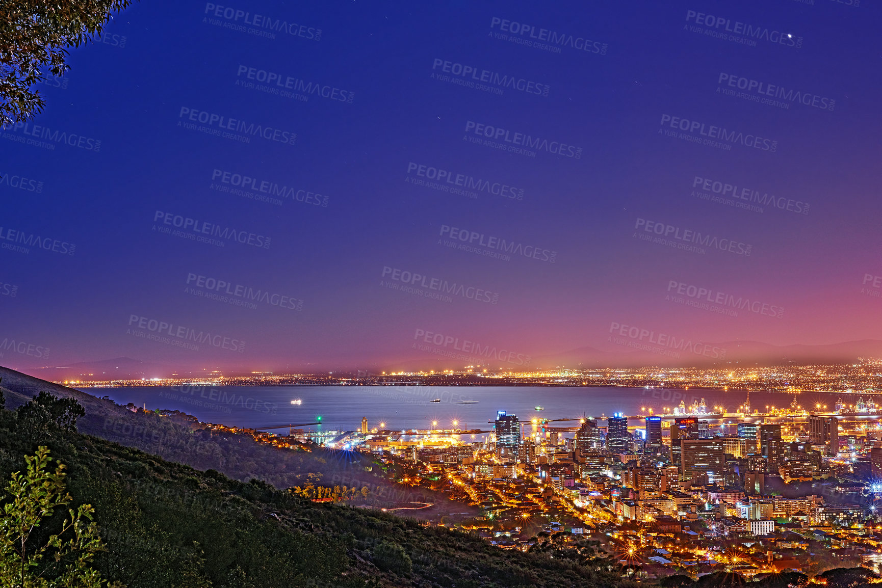 Buy stock photo Signal Hill in Cape Town South Africa with copyspace against dark night sky background and the view of a coastal city. Scenic panoramic landscape of lights illuminating an urban skyline along the sea