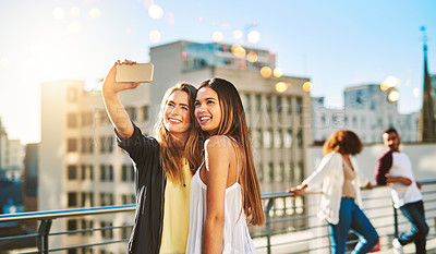 Buy stock photo Shot of young female friends spending the day outside