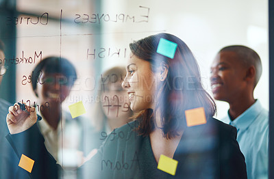 Buy stock photo Business people, glass wall and woman writing,  strategy in office and brainstorming. Sticky notes, planning and group of employees working on ideas, schedule and collaboration for teamwork at work.