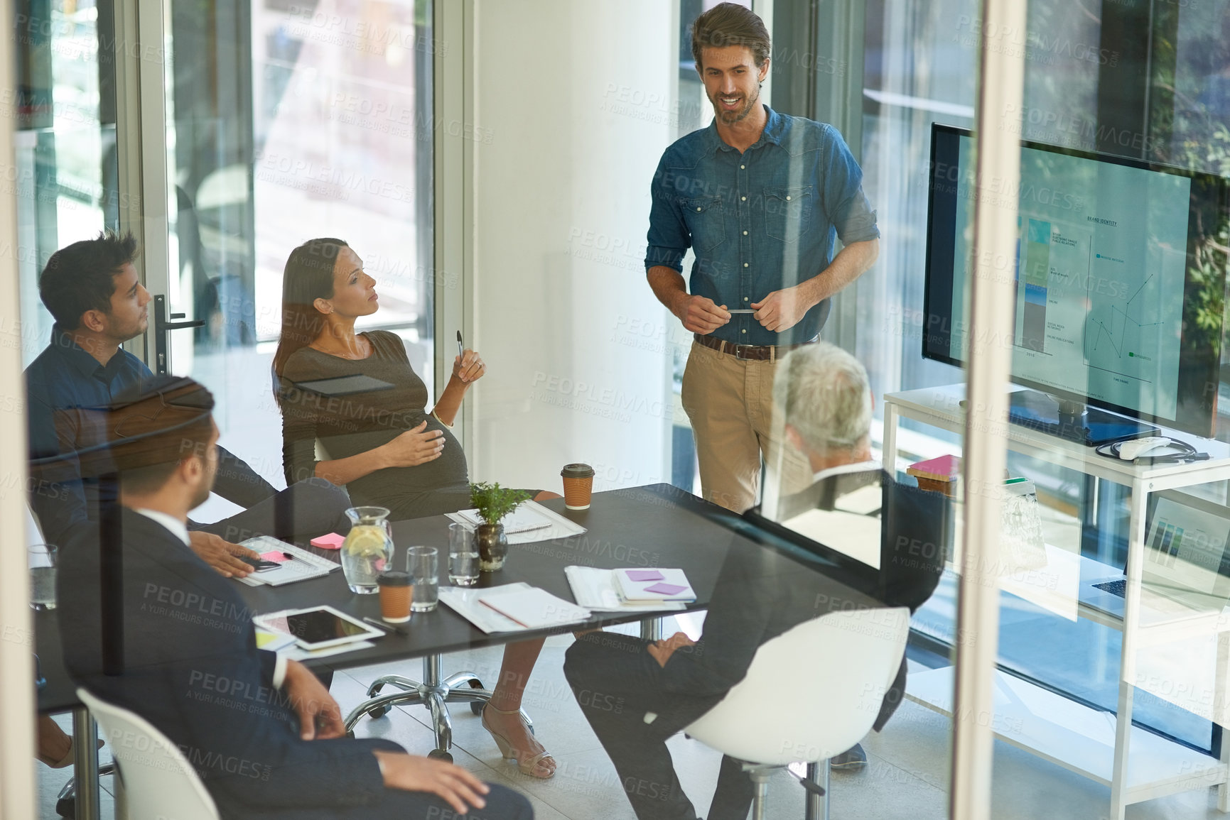 Buy stock photo Shot of a corporate businessperson giving a presentation in the boardroom