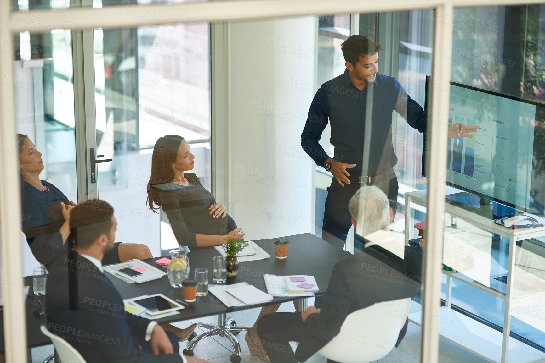 Buy stock photo Shot of a corporate businessperson giving a presentation in the boardroom