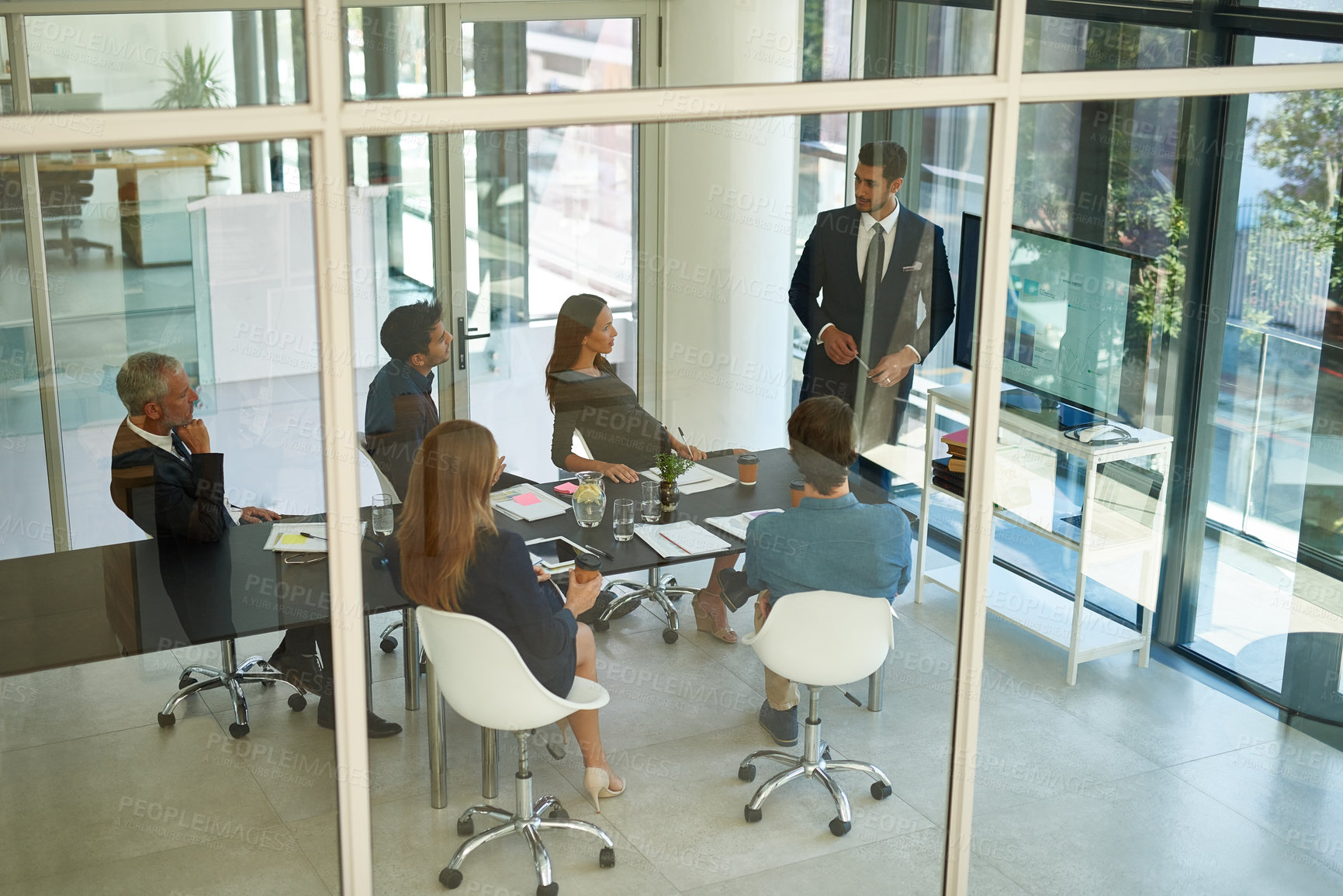 Buy stock photo Shot of a corporate businessperson giving a presentation in the boardroom