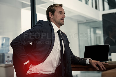 Buy stock photo Shot of a businessman suffering from backache