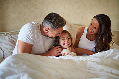 Buy stock photo Shot of a family in the bedroom at home 