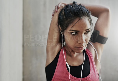 Buy stock photo Shot of a young woman getting fit outside 