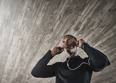 Buy stock photo Shot of a young person working out in and around the city