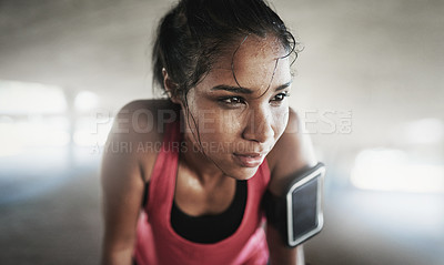 Buy stock photo Shot of a young woman getting fit outside 