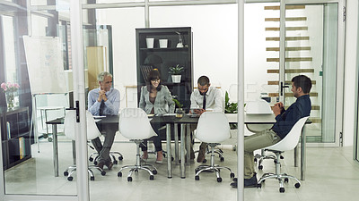 Buy stock photo Shot of corporate businesspeople in the office