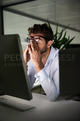 Buy stock photo Tired, night and a businessman with a headache at work, deadline burnout and frustrated. Stress, problem and a corporate employee in a dark office with anxiety or depression from an email on a pc