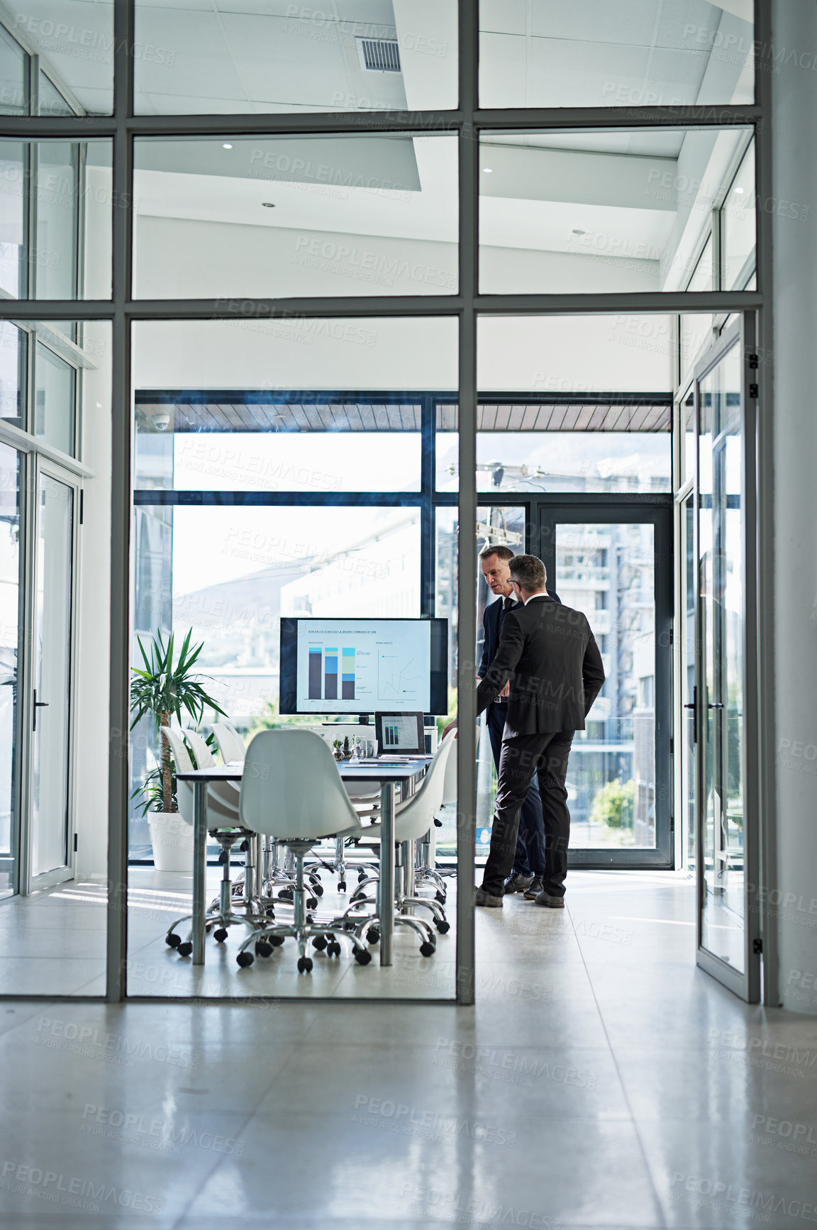 Buy stock photo Shot of corporate businesspeople meeting in the boardroom