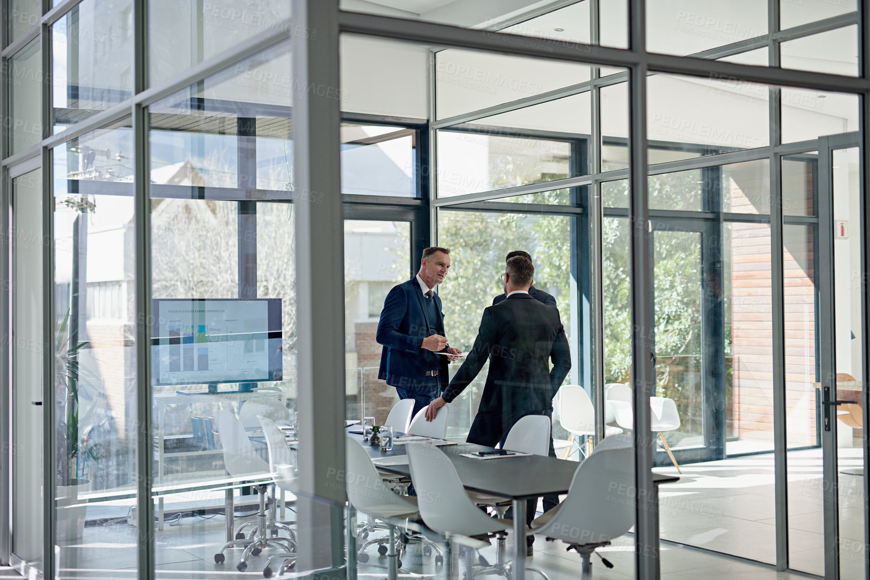 Buy stock photo Shot of corporate businesspeople meeting in the boardroom