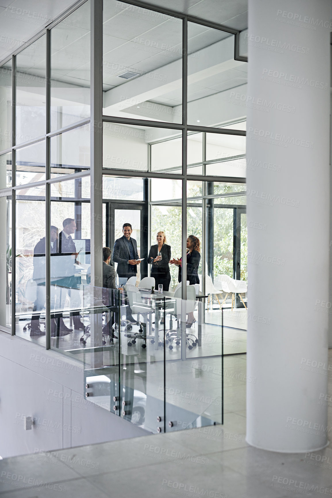 Buy stock photo Shot of corporate businesspeople meeting in the boardroom