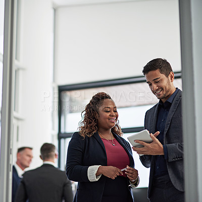 Buy stock photo Smile, tablet and business people in office with advice, ideas or planning online report together. Man, woman and digital app in meeting for discussion, schedule or support in teamwork with low angle