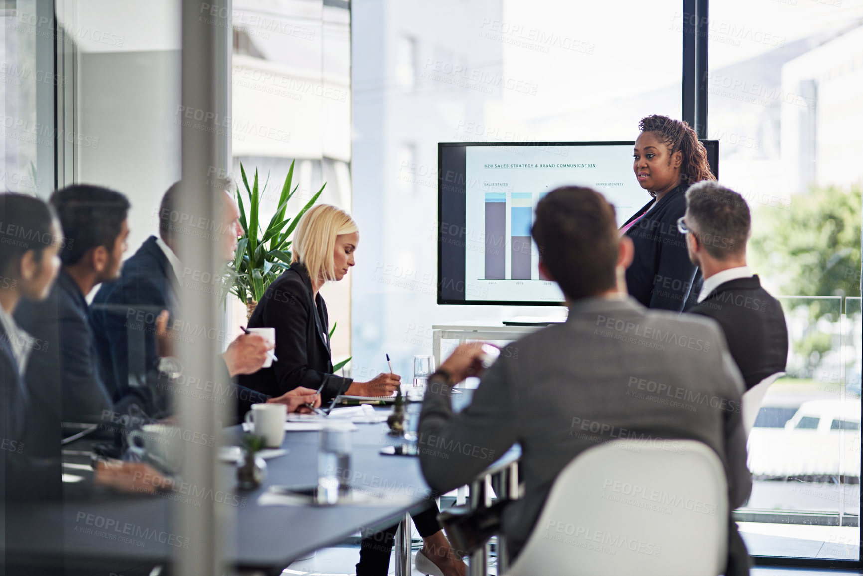 Buy stock photo Shot of corporate businesspeople meeting in the boardroom