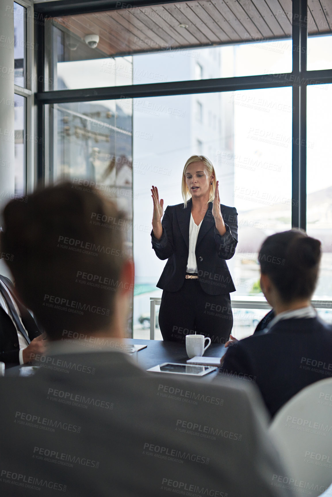 Buy stock photo Shot of corporate businesspeople meeting in the boardroom