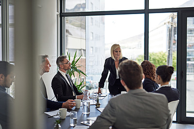 Buy stock photo Shot of corporate businesspeople meeting in the boardroom
