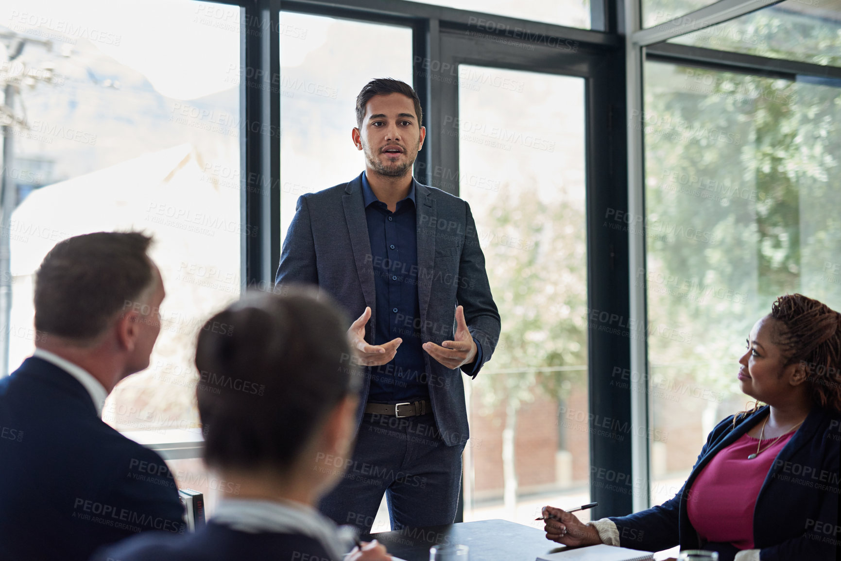 Buy stock photo Shot of corporate businesspeople meeting in the boardroom