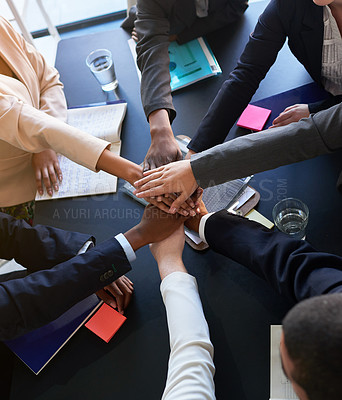 Buy stock photo Diversity, business and group or team of hands in office for unity with support, trust and collaboration for work project. Above, people and huddle together with paperwork for partnership and goals.