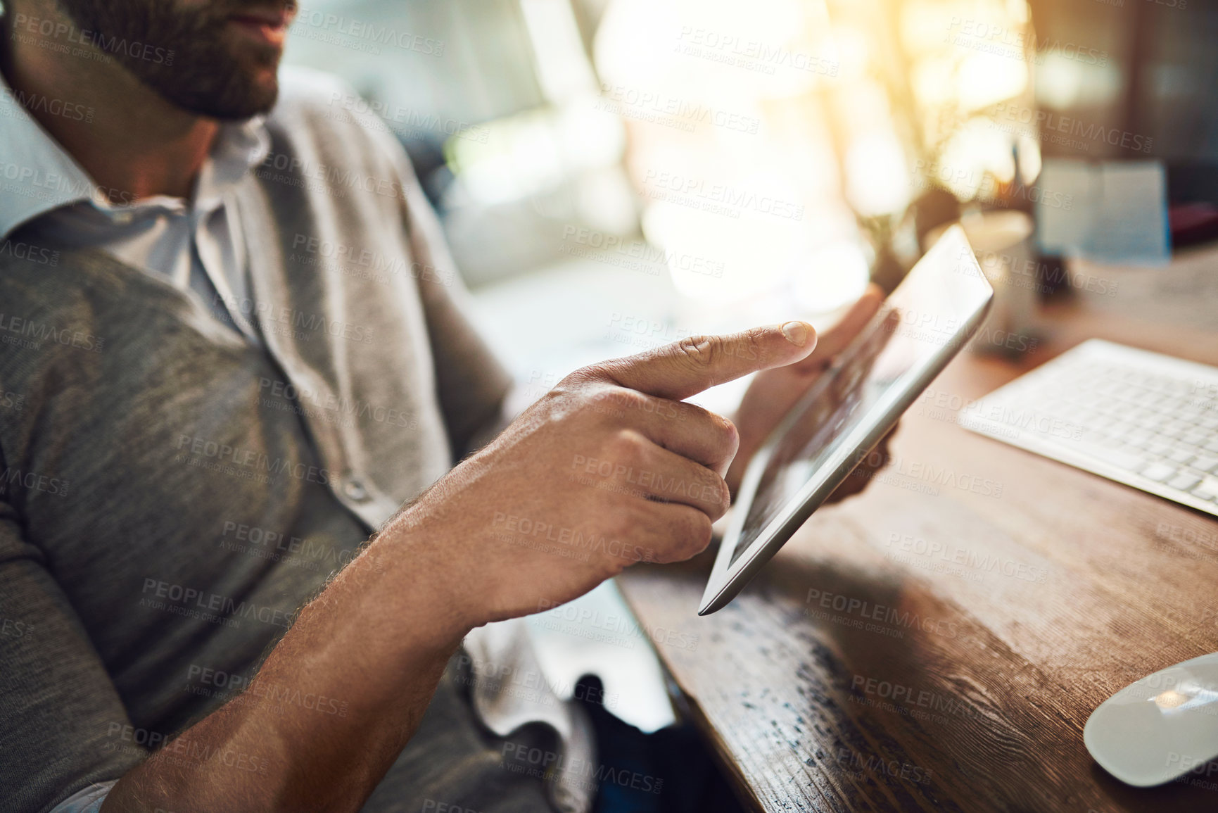 Buy stock photo Tablet, scroll and hands of man at desk with research, connectivity and networking at tech startup. Website, online communication and professional businessman in office with digital app for planning