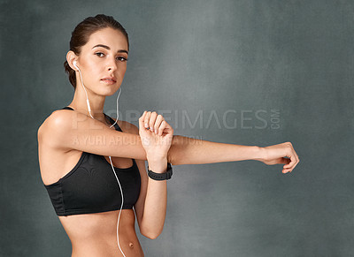 Buy stock photo Studio portrait of a sporty young woman posing against a grey background