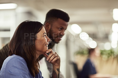 Buy stock photo Shot of two businesspeople working together in an office