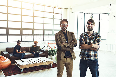 Buy stock photo Shot of two designers standing in a modern office