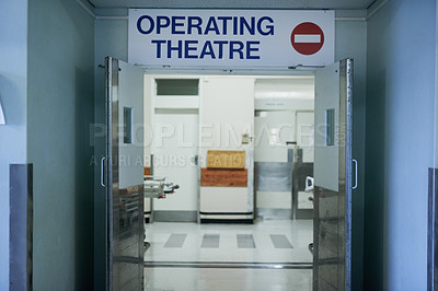 Buy stock photo Shot of open doors leading to an operating room in a hospital
