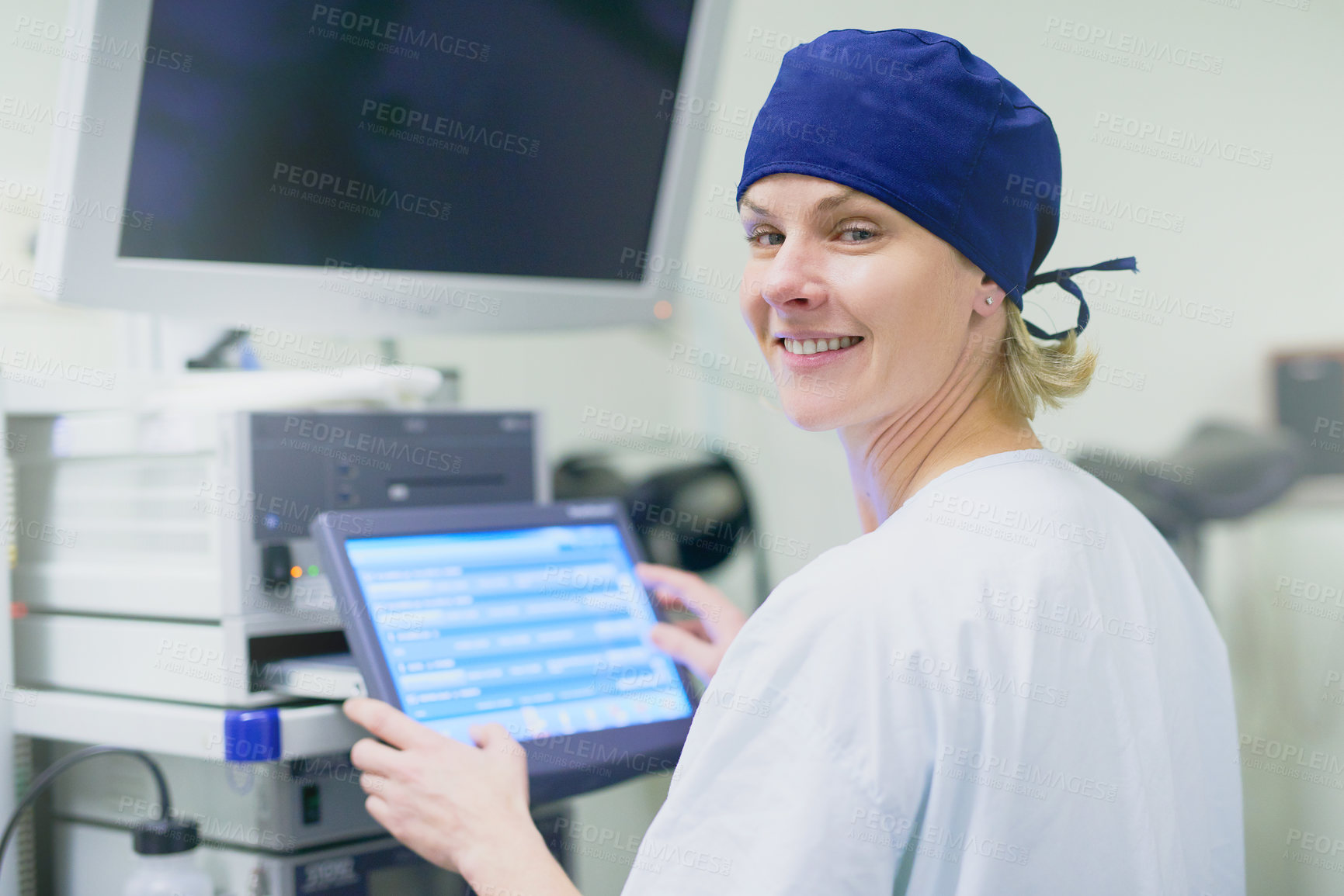 Buy stock photo Portrait of a confident young surgeon working in an operating room