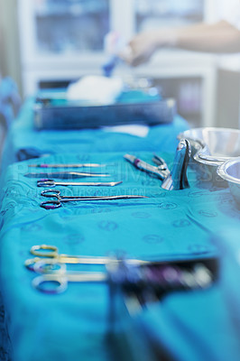Buy stock photo Shot of a variety of surgical instruments on a table