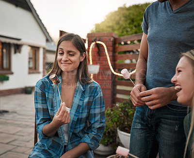 Buy stock photo Burnt marshmallow, laughing and woman with friends in backyard of home for barbecue or celebration together. Funny, relax and social gathering with group of people outdoor at party for comedy