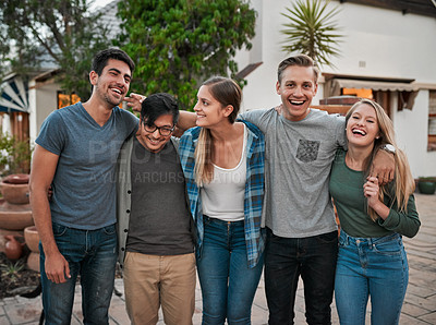Buy stock photo Portrait of a group of cheerful young friends standing together and posing for a photo outside