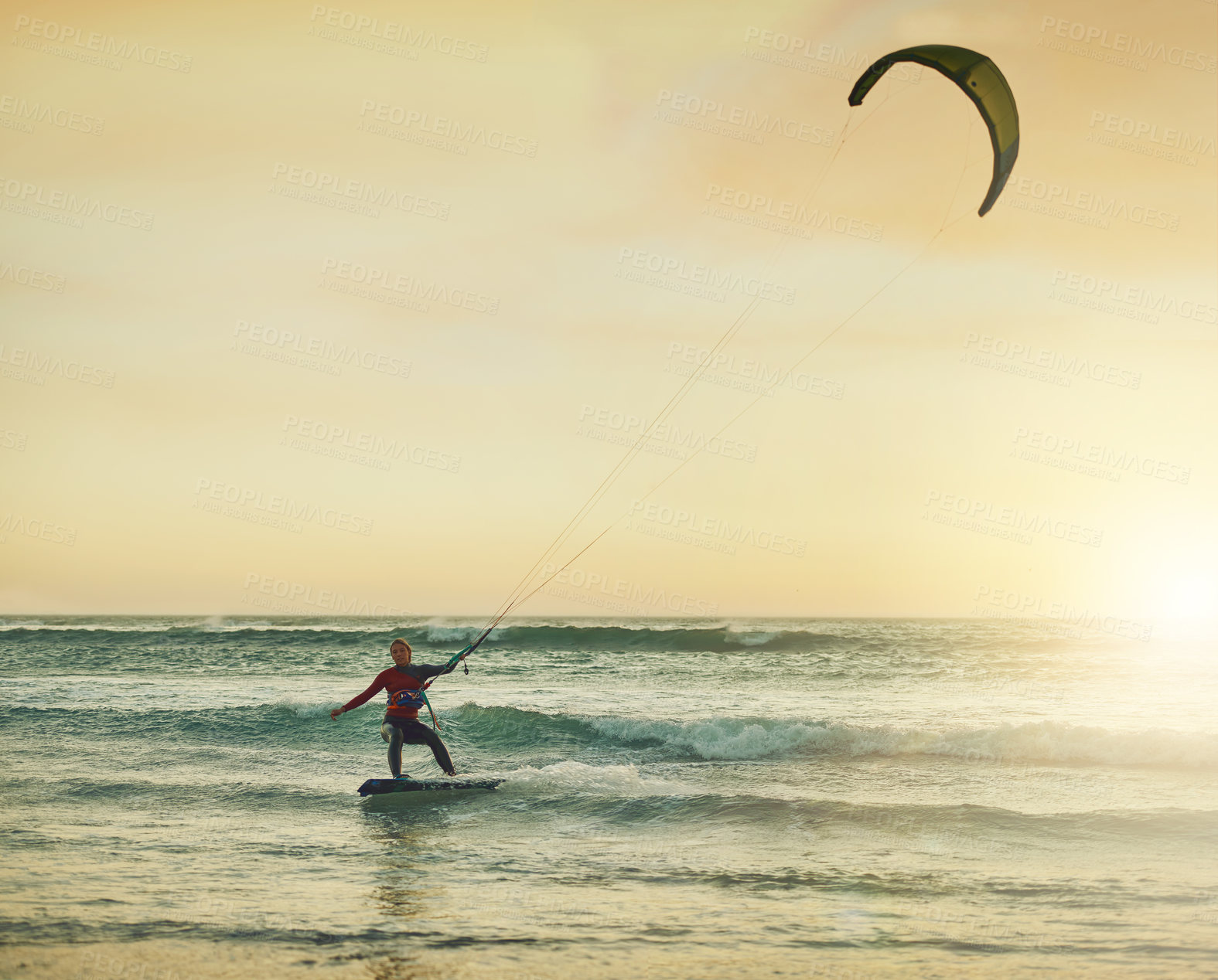 Buy stock photo Sea, woman and kite surfing at sunset for sport, holiday and vacation with mockup space outdoor. Water, action or surfer kiteboarding for riding waves, ocean or training in summer for travel or hobby