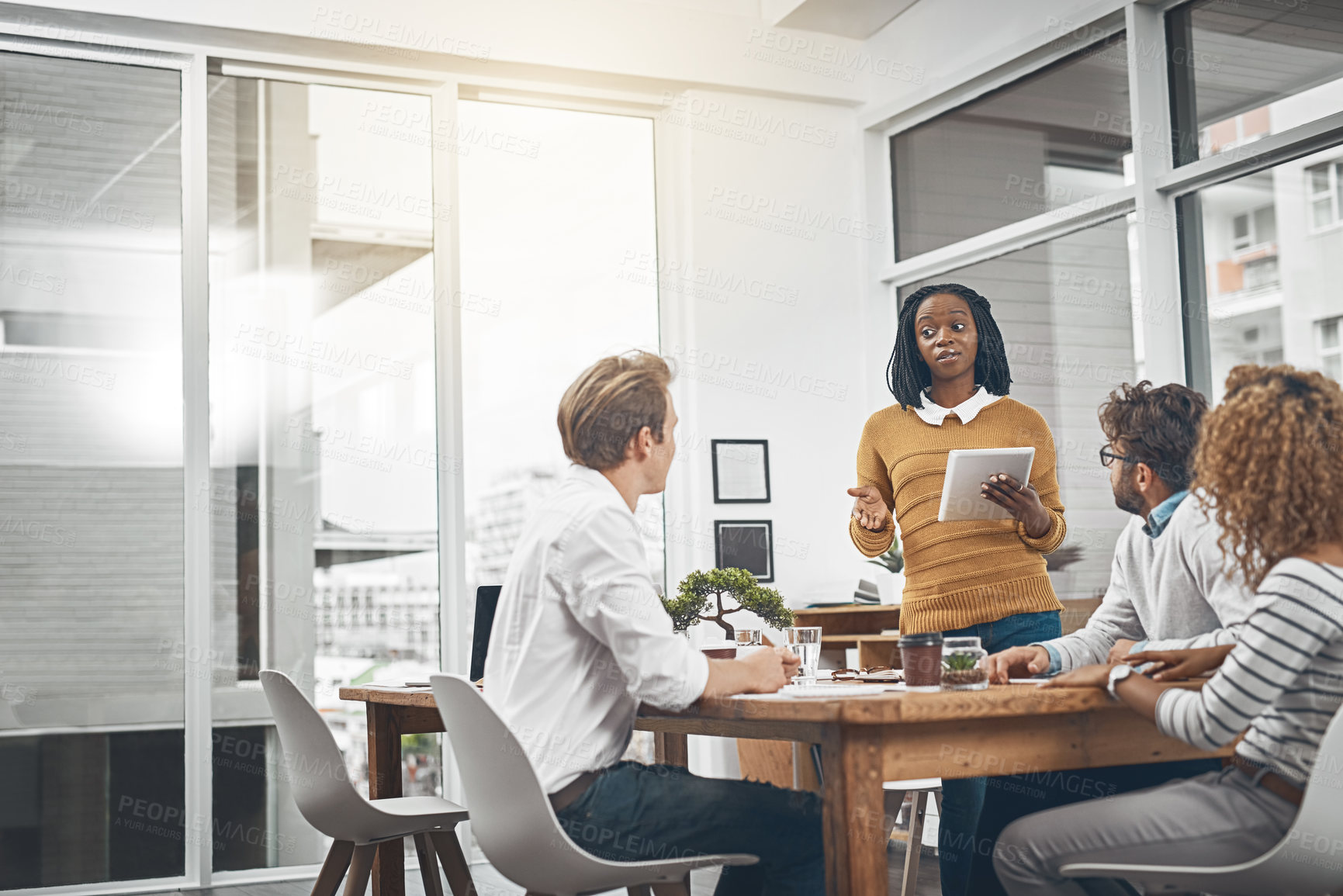 Buy stock photo Shot of a group of businesspeople having a meeting in an office