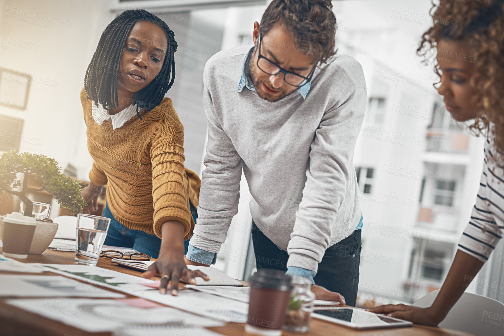 Buy stock photo Shot of a group of businesspeople having a brainstorming session