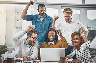 Buy stock photo Shot of colleagues cheering at something on a laptop screen