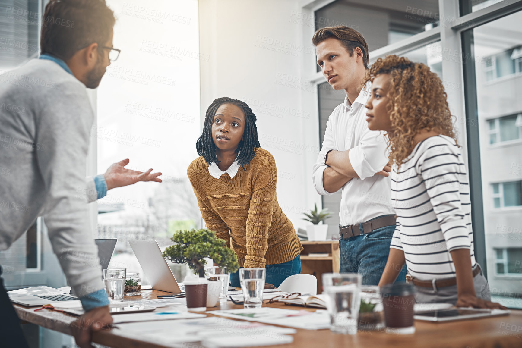 Buy stock photo Shot of a group of businesspeople having a brainstorming session